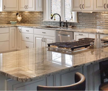 A beautiful kitchen with shining granite countertops