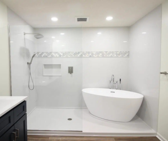 A beautiful white shower with a bathtub in it